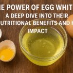 Fresh egg whites in a bowl with cracked eggs on a wooden table, symbolizing their nutritional benefits and health impact.